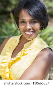 A Beautiful Happy Middle Aged African American Woman Relaxing And Smiling Outside