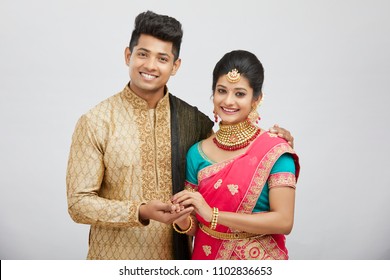 Beautiful happy north Indian couple in traditional dress