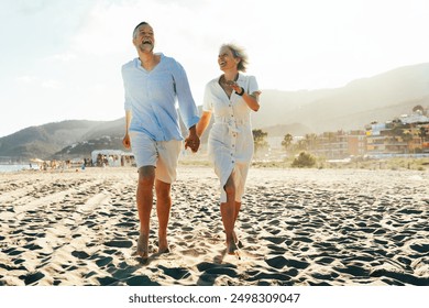 Beautiful happy senior couple dating at the seaside during summertime - Mature married couple in love bonding outdoors at the beach, concepts about elderly lifestyle, relationship and quality of life - Powered by Shutterstock