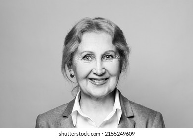 Beautiful happy smiling friendly optimistic senior woman black and white portrait. Lady 60 s years old