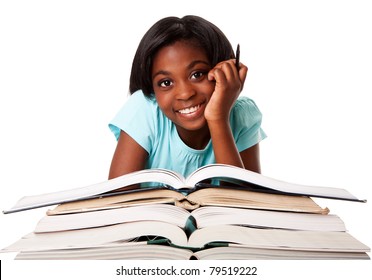 Beautiful happy smiling student with pen and a pile of open books doing homework, isolated.