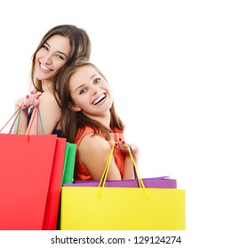 Beautiful Happy Teen Girls With Colored Shopping Sale Bags Over White