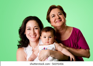 Beautiful Happy Three 3 Generations Of Caucasian Hispanic Latina Women, Grandmother, Mother And Baby Girl, On Green.