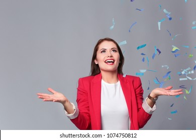Beautiful happy woman at celebration party with confetti .Birthday or New Year eve celebrating concept. - Shutterstock ID 1074750812