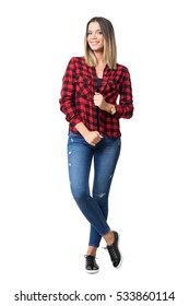 Beautiful Happy Woman Posing White Holding Collar Of Red Plaid Shirt In Jeans.  Full Body Length Standing Portrait Isolated Over White Background. 