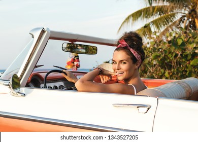 Beautiful And Happy Woman Is Wearing Bandana Driving Retro Cabriolet Car