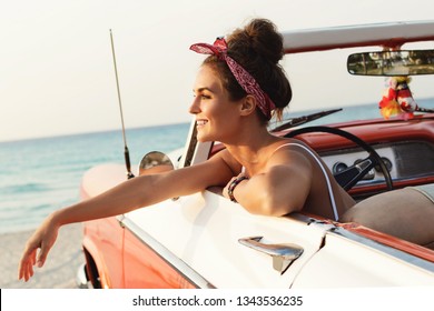 Beautiful And Happy Woman Is Wearing Bandana Driving Retro Cabriolet Car