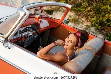 Beautiful And Happy Woman Is Wearing Bandana Driving Retro Cabriolet Car