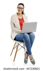 Beautiful and happy woman working with a laptop, isolated over white background  - Shutterstock ID 447230821