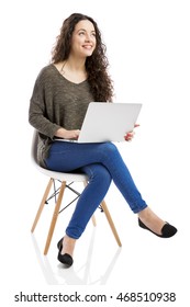 Beautiful and happy woman working with a laptop, isolated over white background  - Shutterstock ID 468510938
