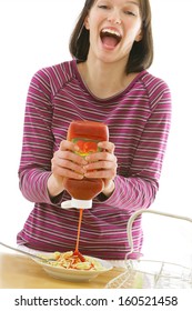 Beautiful Happy Young  Woman Eating Spaghetti With A Lot Of  Ketchup-- - Focus On Ketchup Flowing