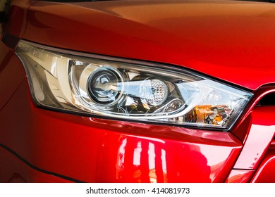 Beautiful Head Light Of Red Car.