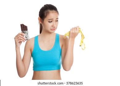 Beautiful  healthy Asian girl very happy with chocolate  isolated on white background