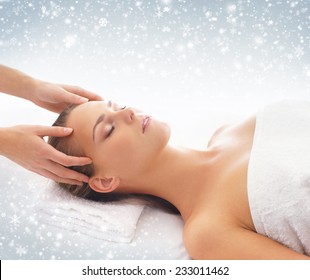 Beautiful and healthy woman in spa. Massage and healing. Winter concept.
