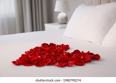 Beautiful Heart Of Red Rose Petals On Bed In Room