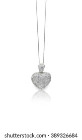 A Beautiful Heart Shaped Pave Diamond And White Gold Or Silver Pendant Dangles From A Chain. Fine Jewelry Necklace Isolated On A White Background With Shadow And Reflection