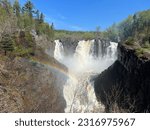 Beautiful High Falls at Pigeon River is a waterfall near Thunder Bay, Ontario.  Viewable both from the Canadian and American (Minnesota) side of the border.  A rainbow is visible as the water thunders