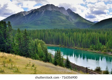 Beautiful high mountains of the Canadian Rockies reflecting in an alpine lake along the Icefields Parkway between Banff and Jasper