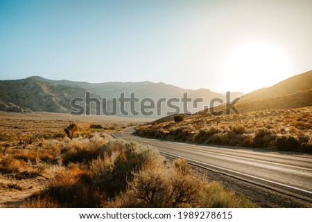 Beautiful hilly landscape in California at sunset, road in the mountains