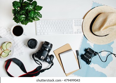 Beautiful hipster flatlay with hat, dslr camera, lens, coffee, map, flower, notebook and binocular. Working space surface top view. Creative work table for photographer, traveller, blogger  - Shutterstock ID 479499043