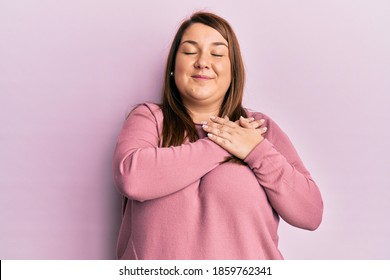 Beautiful Hispanic Plus Size Woman Wearing Casual Winter Sweater Clueless And Confused With Open Arms, No Idea And Doubtful Face. 