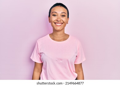 Beautiful Hispanic Woman With Short Hair Wearing Casual Pink T Shirt With A Happy And Cool Smile On Face. Lucky Person. 