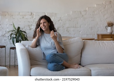 Beautiful Hispanic Woman Sit On Sofa At Home Makes Call, Talks To Family, Involved In Pleasant Conversation On Cell Phone, Share News, Order Goods. Mobile Carrier Operator, Phone Communication Concept