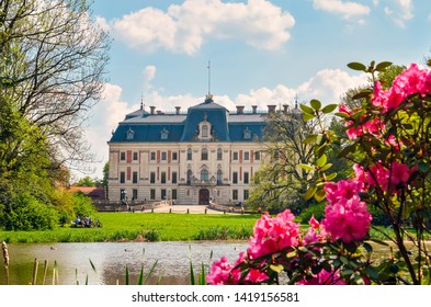 Beautiful historic castle in colorful spring scenery. Neo baroque castle in a park in Pszczyna in Poland. - Shutterstock ID 1419156581