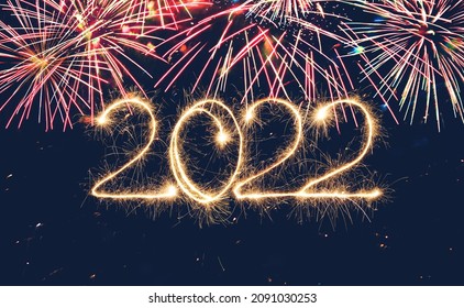 Beautiful Holiday background Happy New Year 2022  Sparkling burning text 2022 on blue background with fireworks. Сolorful Template for design greeting card, flyer, billboard or Web banner - Shutterstock ID 2091030253