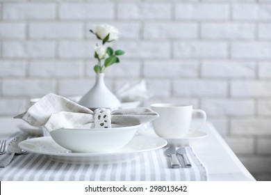 Beautiful Holiday Table Setting In White And Gray Color