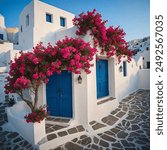 Beautiful home with bougainvillea flowers in Santorini, Greece.
