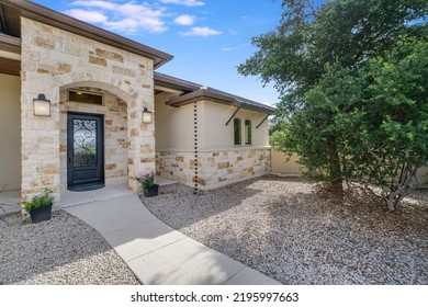 A Beautiful Home Entrance With Stone Accents