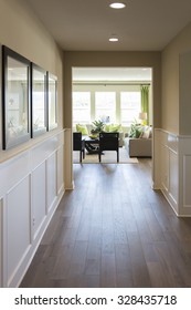  Beautiful Home Entry Way with Wood Floors and Wainscoting.