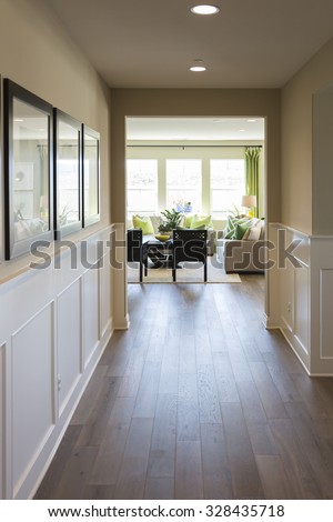  Beautiful Home Entry Way with Wood Floors and Wainscoting.
