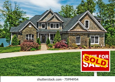 Beautiful Home with Sold Sign in Front Yard