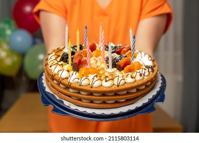 Beautiful Honey Cake With Prunes And Dried Apricots In The Hands Of A Woman