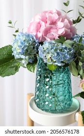 Beautiful Hortensia Flowers In Vase On Stand Indoors