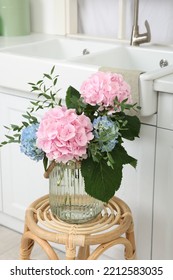 Beautiful Hortensia Flowers In Vase On Stand Indoors