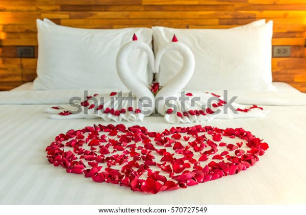 Beautiful hotel for honeymoon sweet.Swan
couple put on honeymoon bed look like heart shape with rose petals
for honeymoon lover.The staff hotel put yellow lighting in the room
make romantic
feeling.

