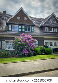 Beautiful House In The District Margarethenhoehe With A Flowering Rhododendron In Front Of The Building. The Settlement Is The First Example Of The Garden City Movement In Germany.