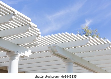 Beautiful House Patio Cover Against The Blue Sky.