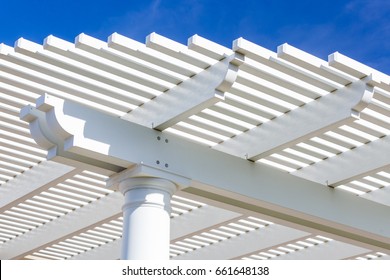 Beautiful House Patio Cover Against The Blue Sky.