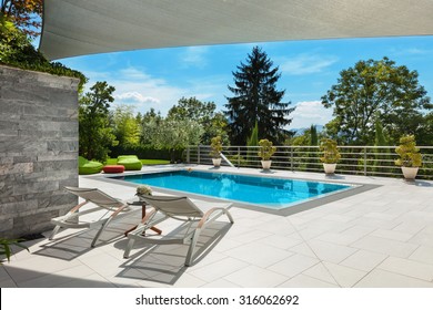 beautiful house, swimming pool view from the veranda, summer day