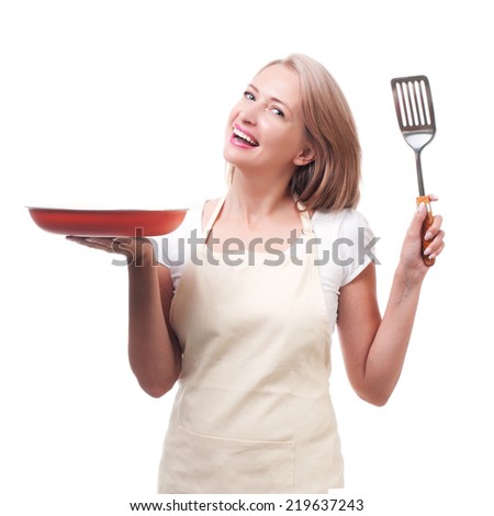 Beautiful housewife with spatula. Isolated on white background