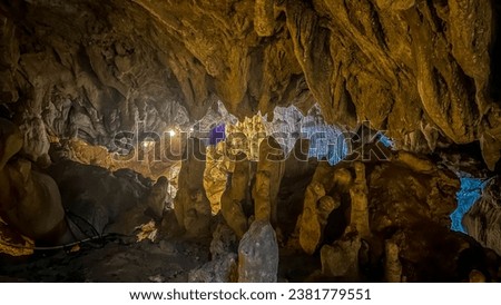 Beautiful Huge limestone formations and spectacular stalactites in various forms of Angel Cave or Tham NangFa in Vang Vieng, Laos