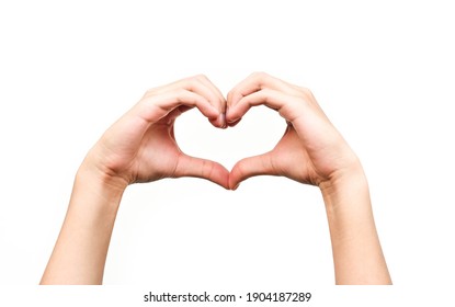 beautiful human hands giving heart signal on isolated white background