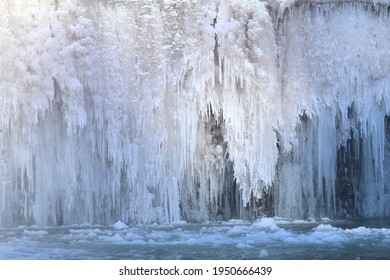 Beautiful Icefall On River During Winter