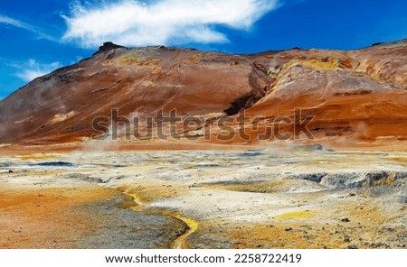 Beautiful icelandic colorful volcanic nature landscape valley, yellow sulfur deposits, red mountains, steaming hot ground  - Seltun Krysuvik  geothermal area, Iceland