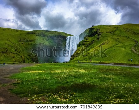 Beautiful Icelandic Landscape in Skogar. Skogafoss Waterfall on a Cloudy day.