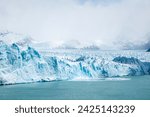 Beautiful image of the impressive Perito Moreno glacier in El Calafate, Argentina. Imposing ice wall of the Perito Moreno glacier. Huge iceberg breaking off from Perito Moreno. 